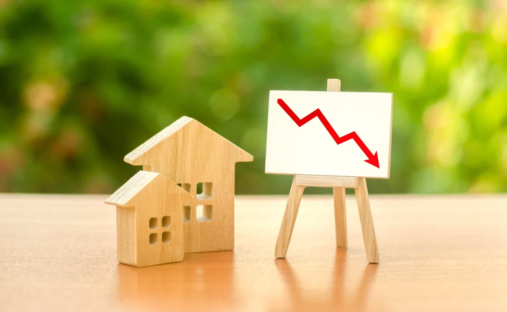 casas e seta a descer