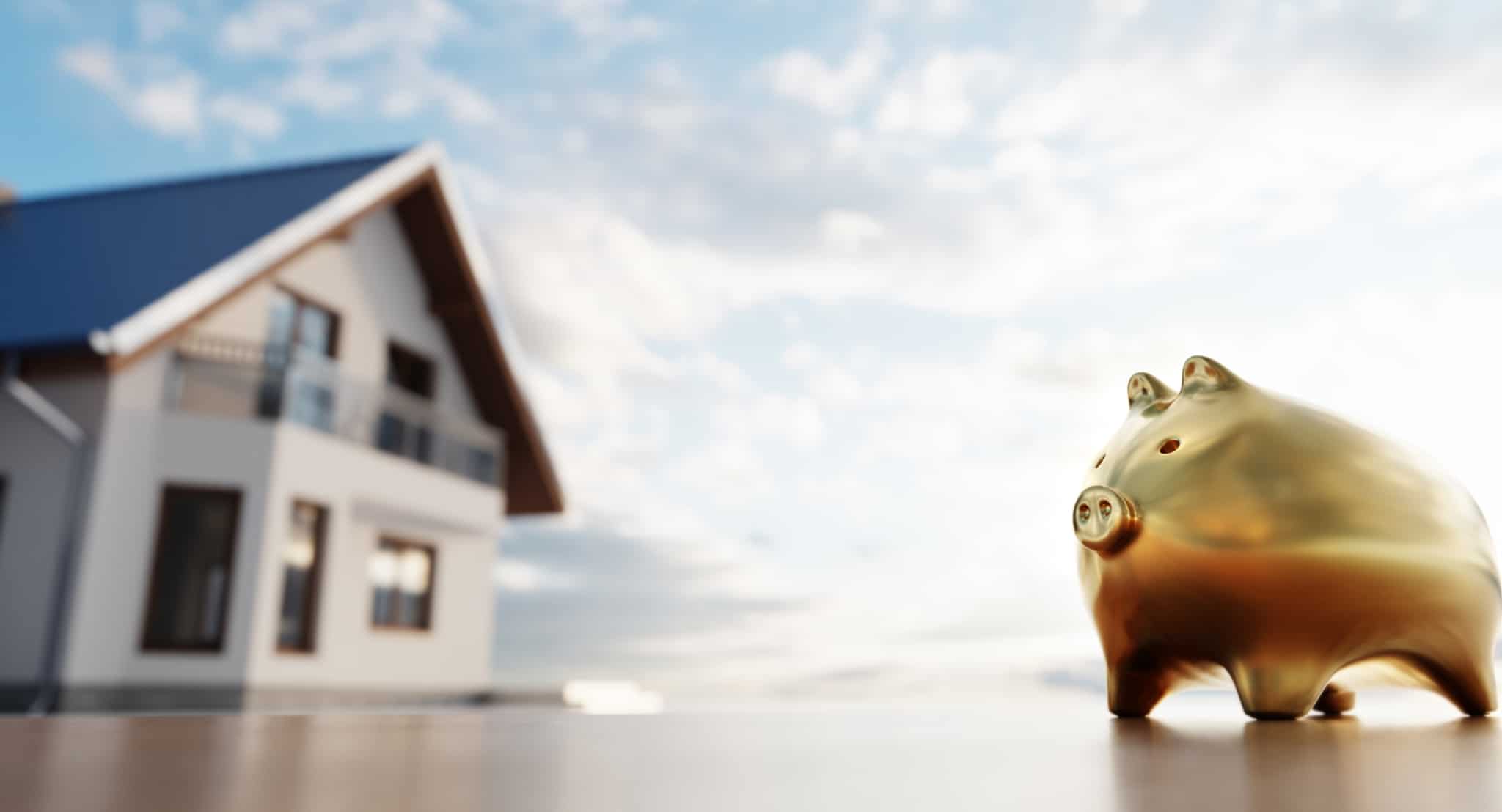imagem de uma casa e de um porquinho mealheiro dourado a ilustrar que as Famílias podem usar o PPR para pagar o empréstimo da casa em 2023